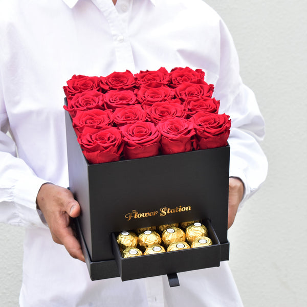 red infinity roses in a box