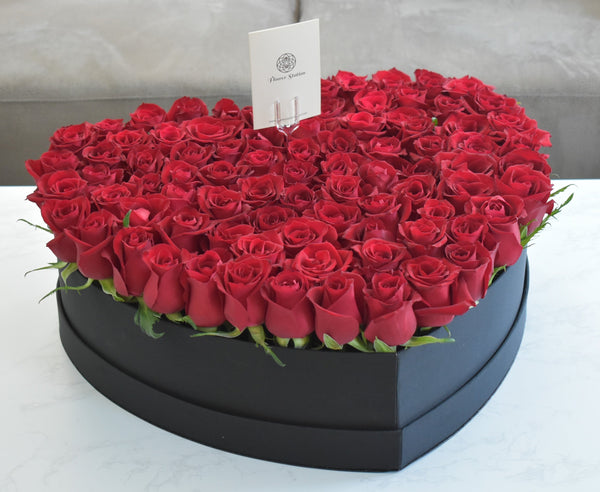 red rose in heart box