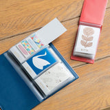Keep your KITTA washi tapes organized and ready to go with this convenient file book.  It features slots for 24 Kitta booklets, letting you flip through your collections and peel off a piece of washi one at a time. 