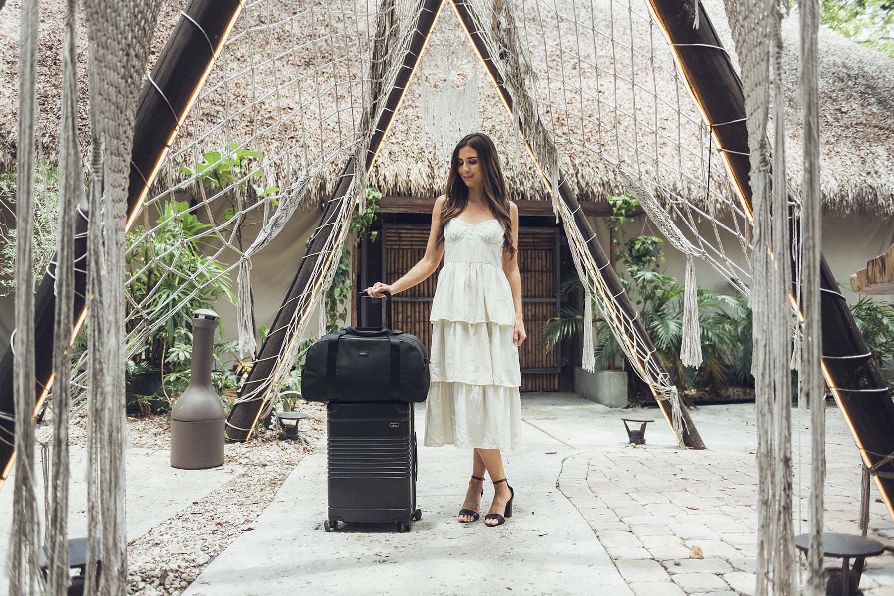 Amanda Gilbert with the Arlo Skye Carry-On Max and Weekender in Black.
