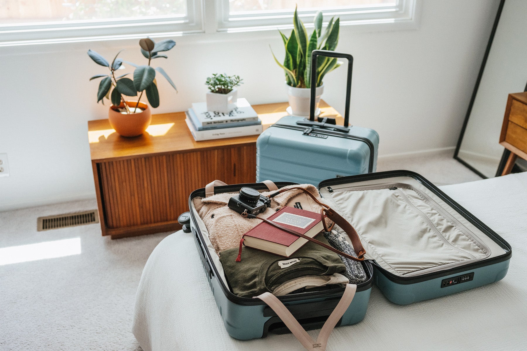 image of carry-on max laid flat on bed open