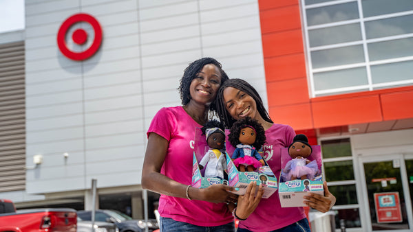 Zoe and Evana with new dolls at Target