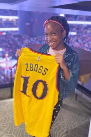 Zoe with custom hawks jersey