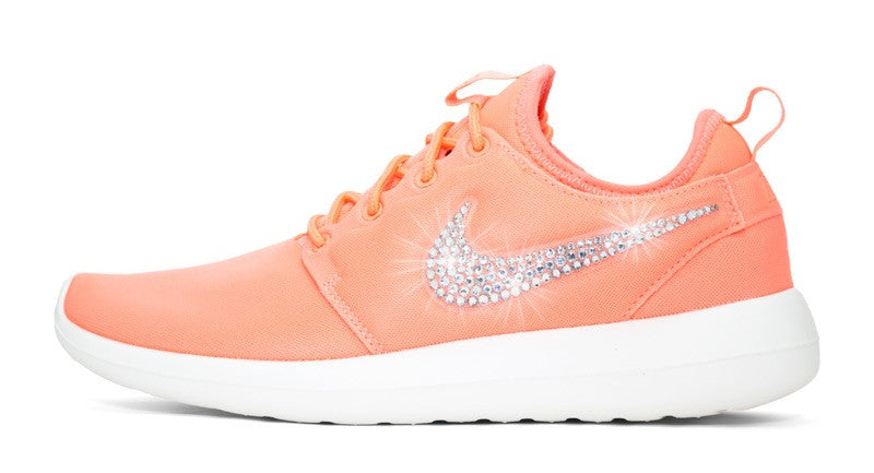 pink white and orange nike shoes