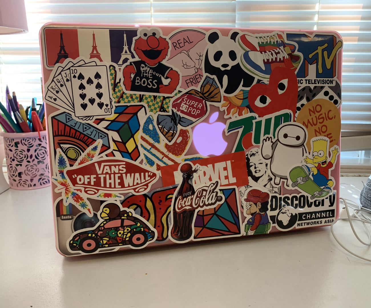 MacBook with aesthetic stickers