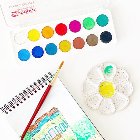 daisy palette by SMO ceramics with paints paintbrush and sketchpad