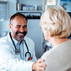 a doctor holding a patients shoulder