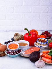 bell pepper, fish, garlic and other collagen source food on top of the table