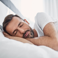 A man lying in bed sleeping