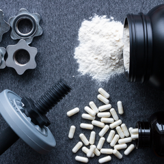 a close-up of a bottle of white powder and white capsules