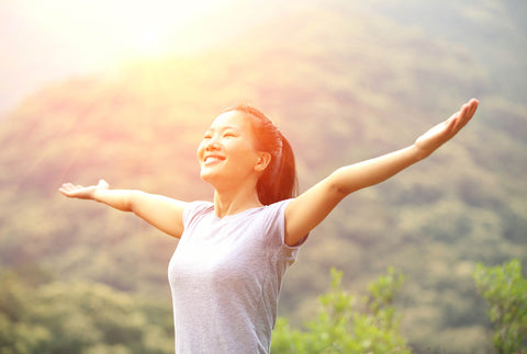 A happy woman with her arms wide open