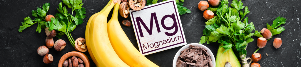 A magnesium cardboard on a table surrounded by food such as banana, leaves, nuts, and avocado