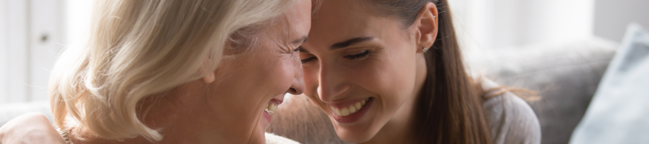 A miling mom and daughter