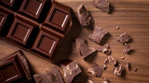 a chocolate bar and pieces of chocolate