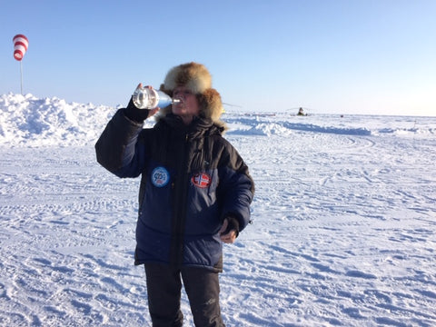 Drinking iceberg water on the sea ice at Barneo base by North Pole