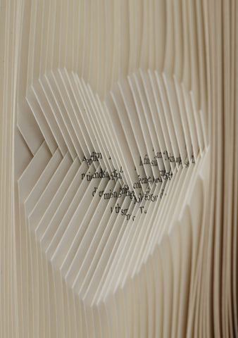 Close up of folded pages heart shape