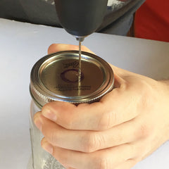 Drilling the top of the mason jar