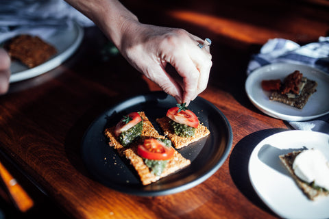 Sundried tomato, raw, vegan, keto crackers with tomato and pesto 