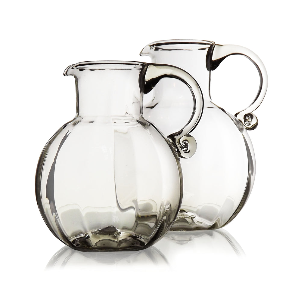 glass water jug crossword clue