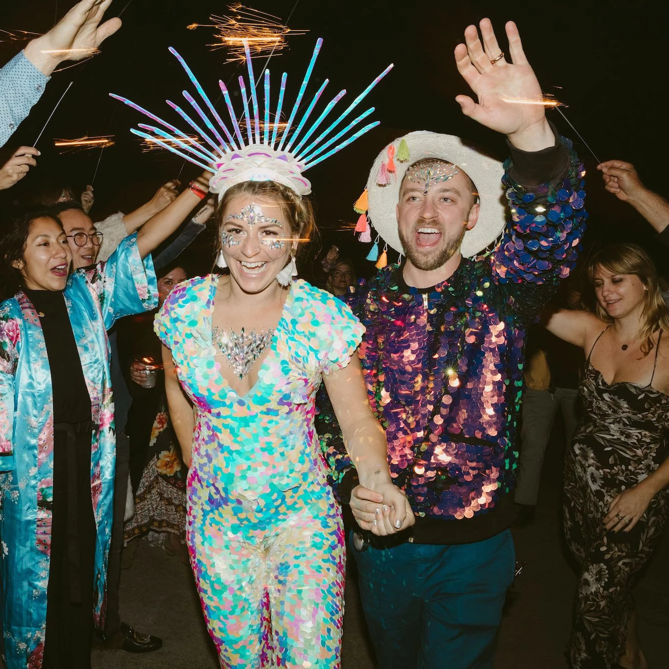 A bride and groom wear sequins to their festival wedding 