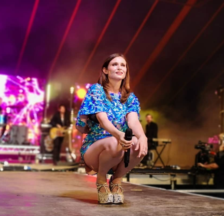 Sophie Ellis-Bextor wearing Rosa Bloom aqua blue sequin romper playsuit outfit on stage