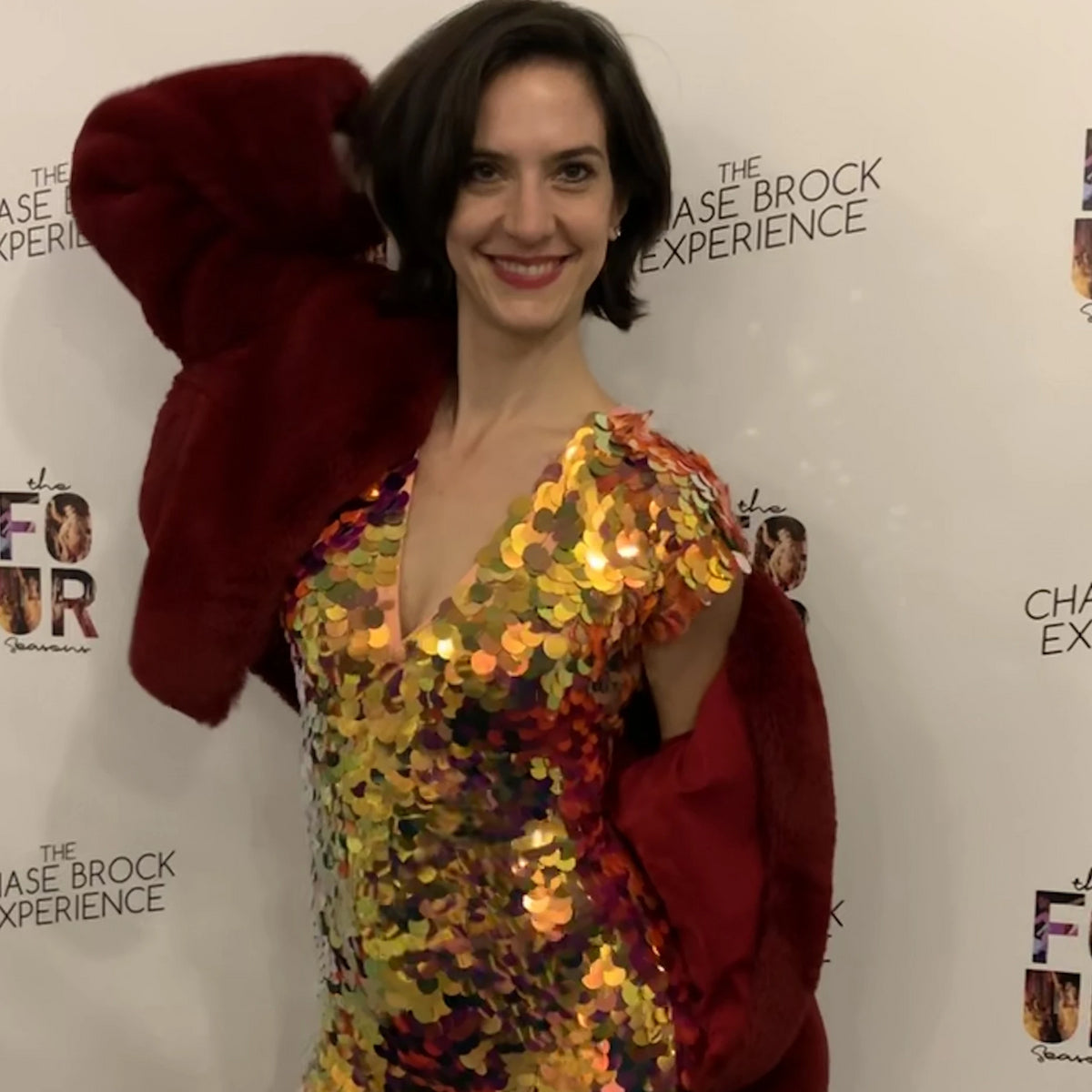 Woman in fur jacket and sequin jumosuit attends an event in New York 