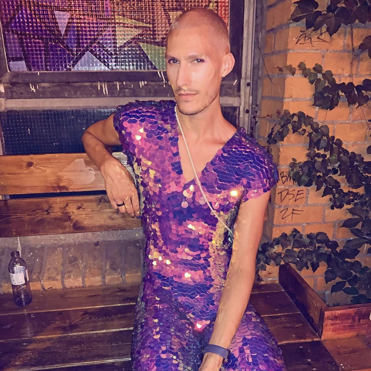A man wearing a full sequin jumpsuit 
