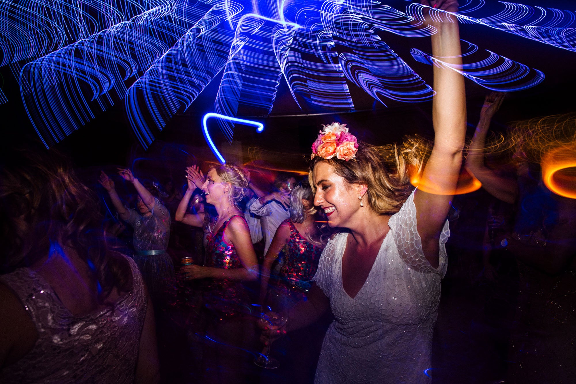 A bride dances at her festival themed wedding 