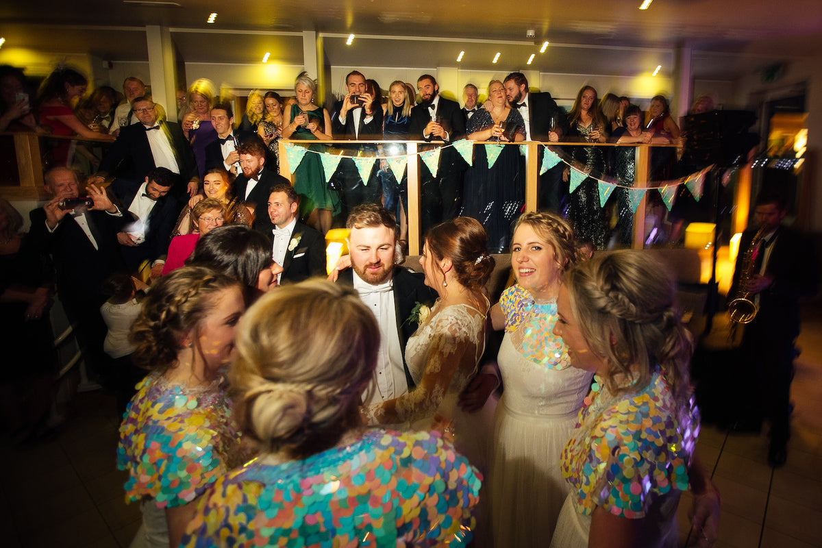 Bride and groom take to the dance floor with bridesmaids
