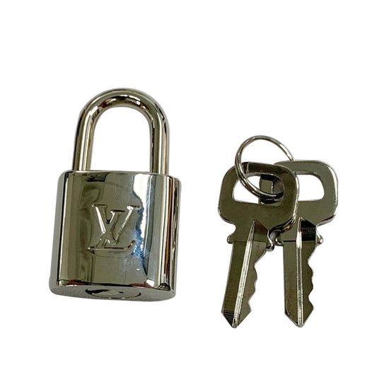 Lot 999 - Two Louis Vuitton lock and keys.