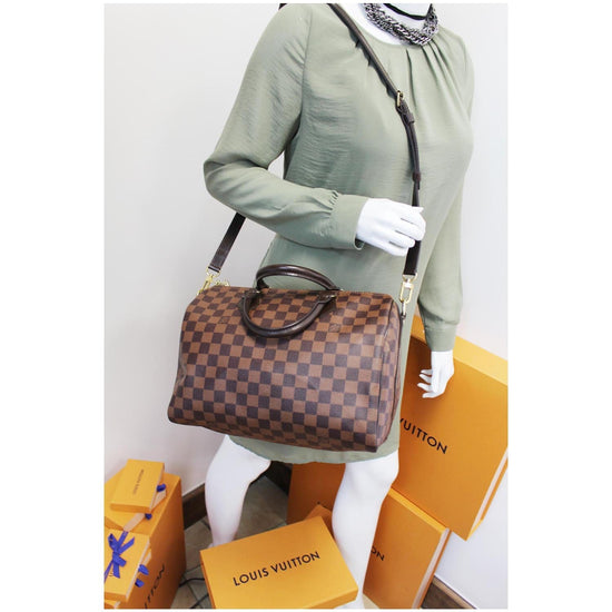 LOUIS VUITTON, PATCHES SPEEDY 30 BANDOULIERE OF DAMIER EBENE CANVAS WITH  POLISHED BRASS HARDWARE, Handbags & Accessories, 2020