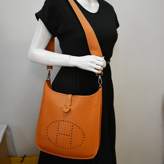 Orange leather, canvas and palladium hardware Evelyne PM 29, Hermès, 2011, Hermès Handbags & Accessories Online, Jewellery