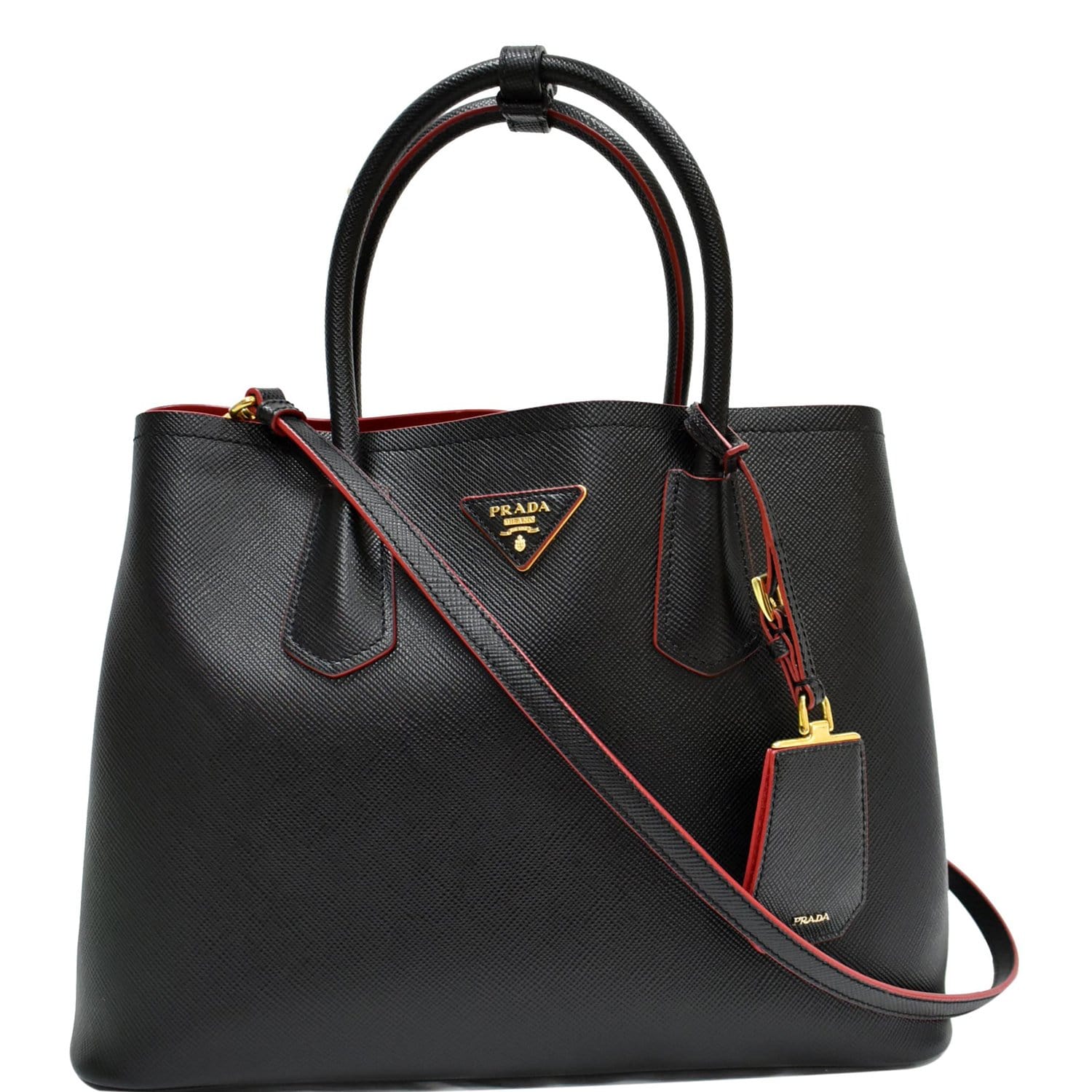 The Prada Double bag in Saffiano Cuir leather comes with a double handle  and detachable shoulder strap. A flap pocket …