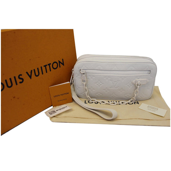 At Auction: Louis Vuitton, LOUIS VUITTON VOLGA clutch bag.