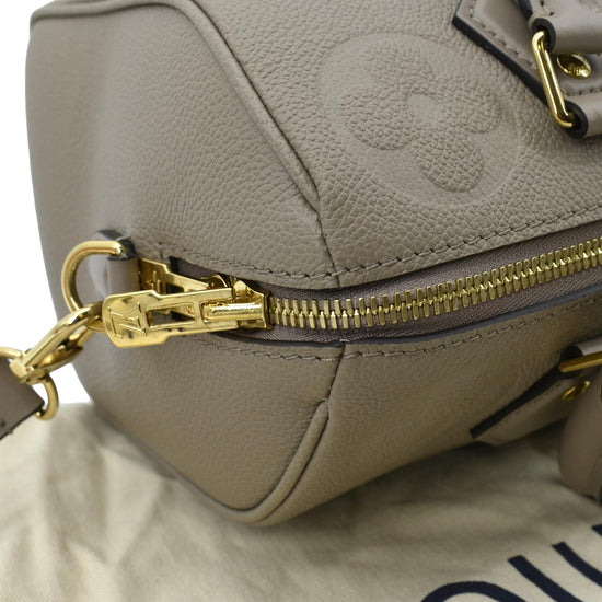 Louis Vuitton Citrine Monogram Empreinte Speedy Bandouliere 25, $2,500, Gilt