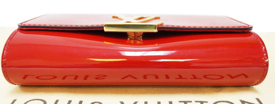 LOUIS VUITTON- Red patent leather bag in its pouch, circ…