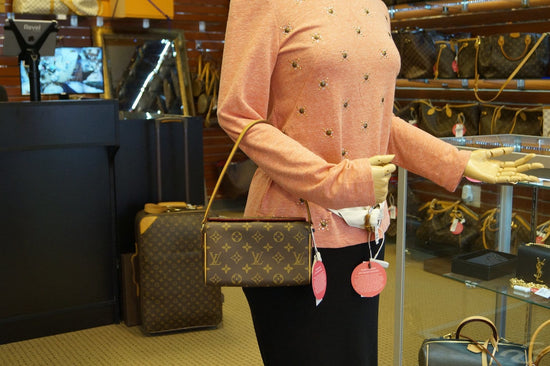 This adorable Louis Vuitton Monogram Canvas Recital Bag is an