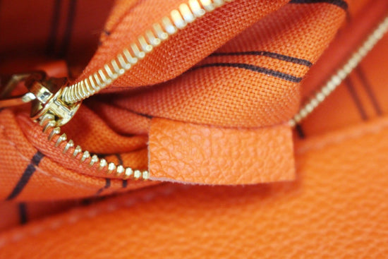 LOUIS VUITTON Orange Monogram Empreinte Leather Bagatelle