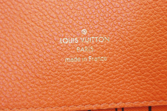 Clutch bag Louis Vuitton Orange in Other - 24736278