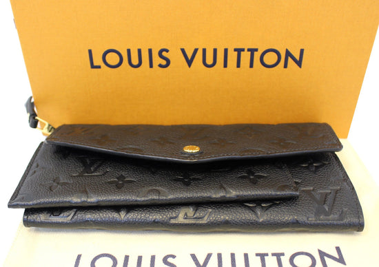 Louis Vuitton, a black Monogram Empreinte leather 'Clémence' wallet, 2017.  - Bukowskis