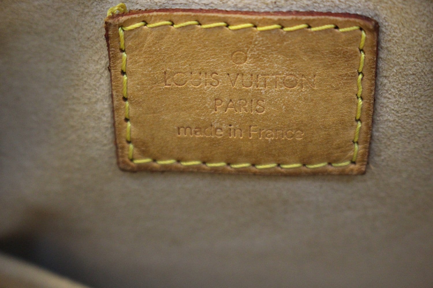 louis vuitton label inside purse