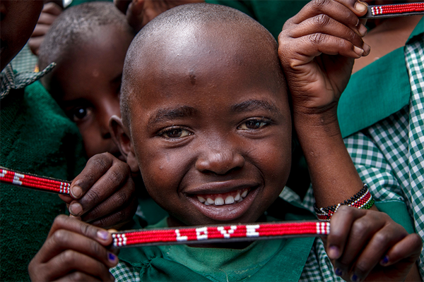 Maasai children with Love Is Project bracelets Kenya