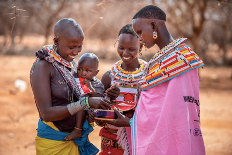 Maasai women and a box of This Saves Lives bars