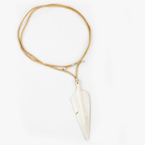 The White Feather Foundation collaborates with Love Is Project white feather engraved upcylced unisex camel bone necklace