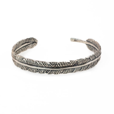 The White Feather Foundation x Love Is Project offering Balinese artisan made unisex silver feather cuff 