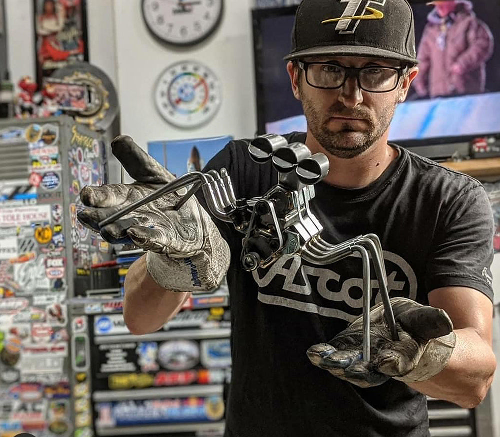 Thomas Pastis holding his sculpture