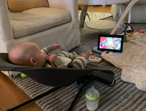 baby watching tv in lounger