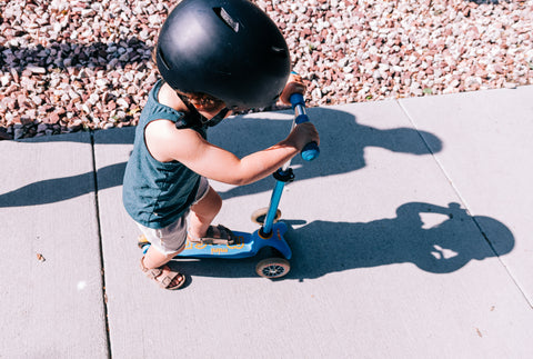 Little kid on a scooter