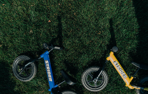 Strider bikes in the grass