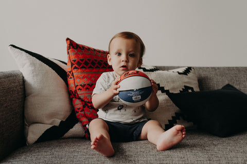 Baby boy playing with ball